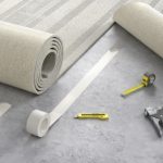 Process,of,laying,cozy,beige,carpet,on,floor,,3d,illustration